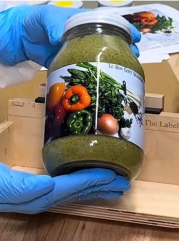 Natural Haitian spice blend bottle, Epis seasoning base with fresh parsley, garlic, and Scotch bonnet peppers